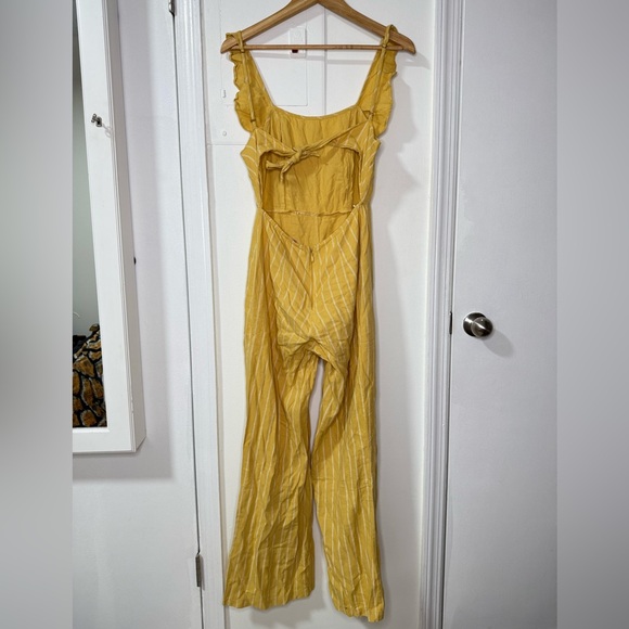 Yellow pinstripe tie back jumpsuit with front ruffle & adjustable straps. Size M - Picture 3 of 8